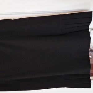 Skirt with folders on the both sides zipper on the top left side  very good cond